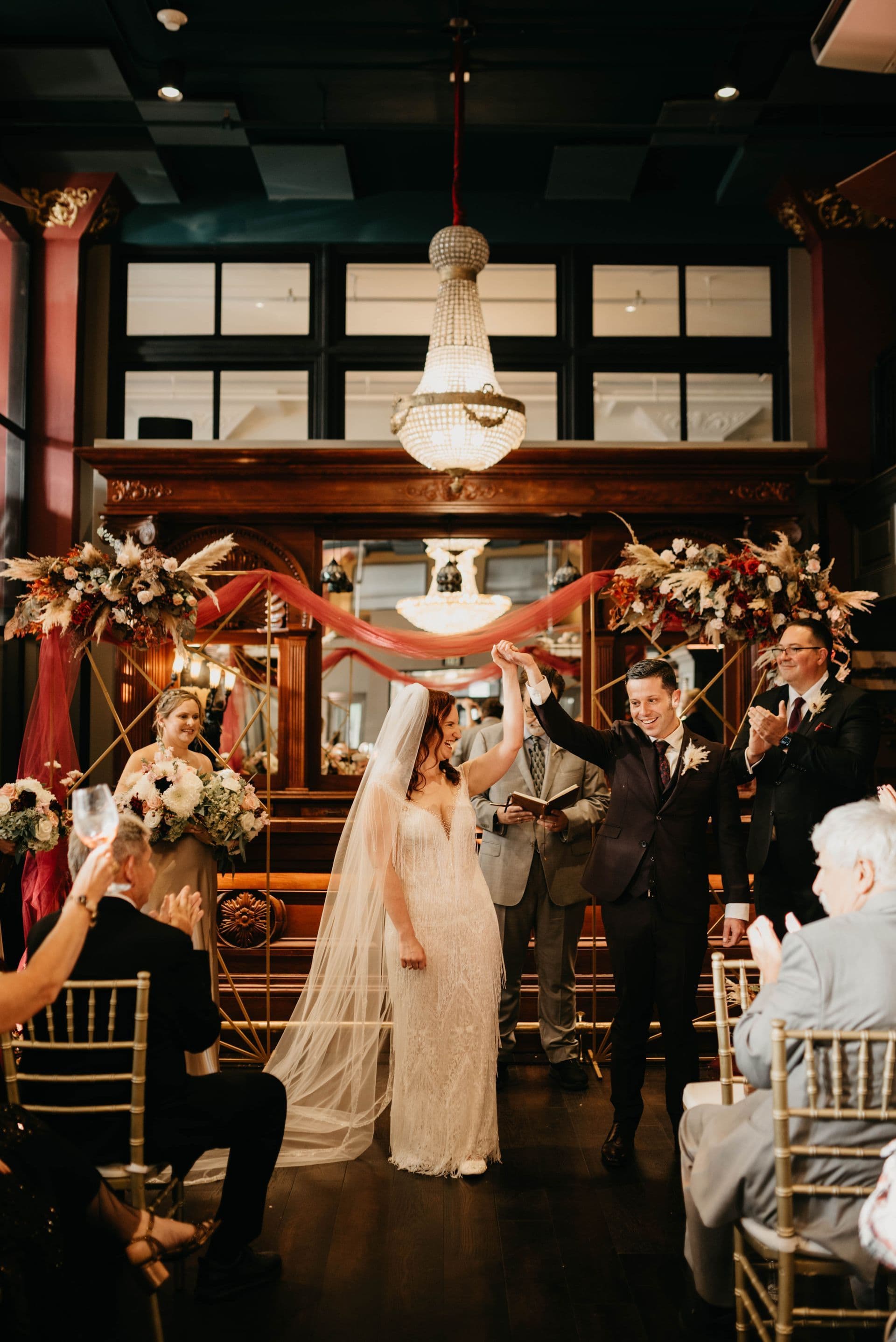 Chris and Amy celebrating their wedding at Devils River Whiskey in San Antonio