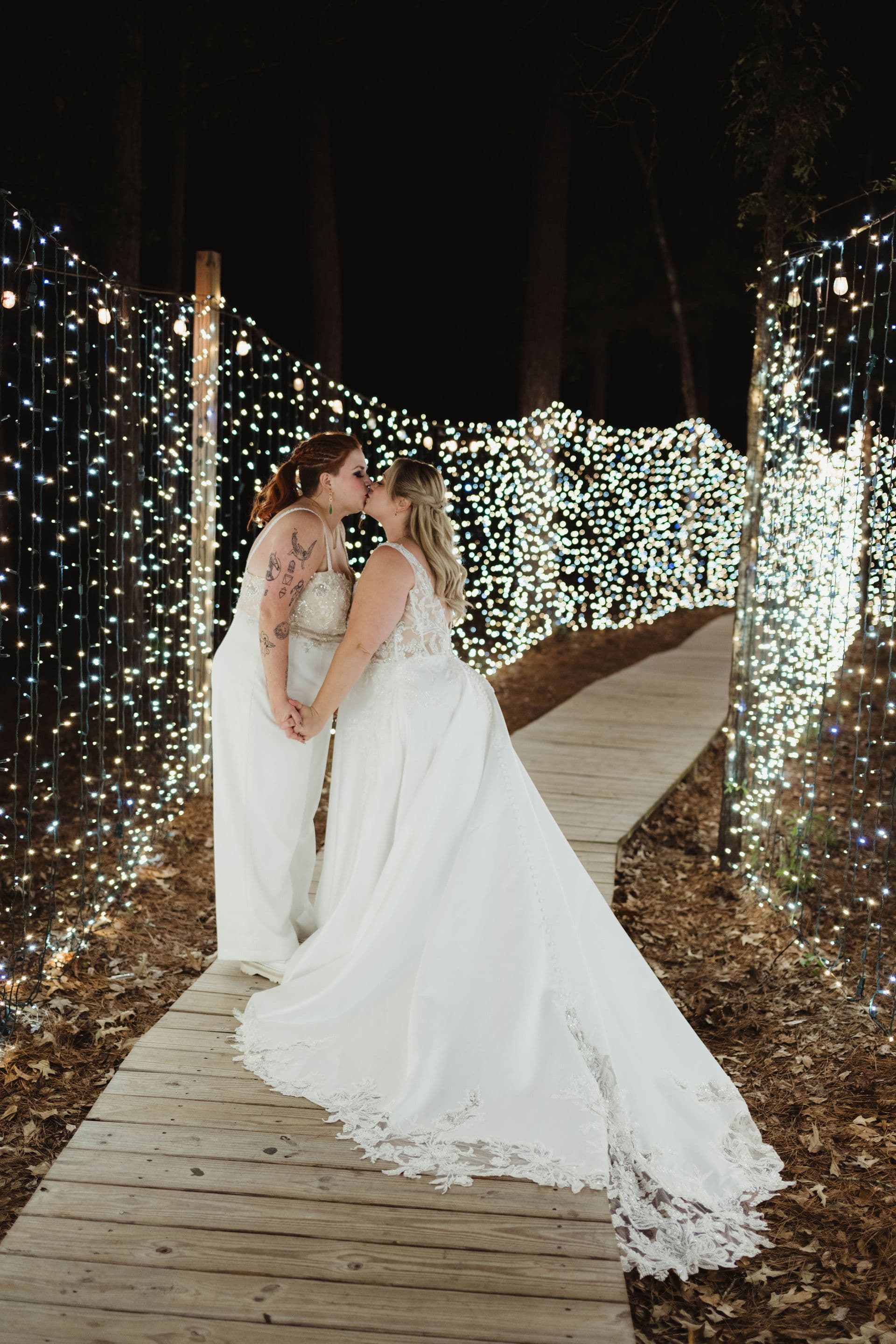 Paige and Ashley together beneath twinkling lights at the Shire